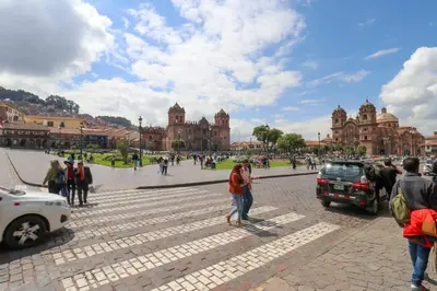 a group of people standing on a street in a city at Casa Muru By Wynwood House in Cusco