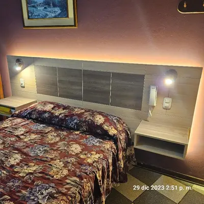 a hotel room with a bed in a room at Hostal La Cascada in Lima