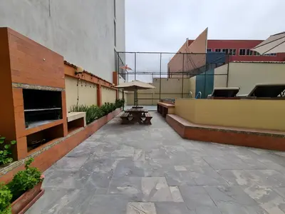 a patio with a bench and a table on a building at Acogedor 2BR Center Miraflores - Balta in Lima