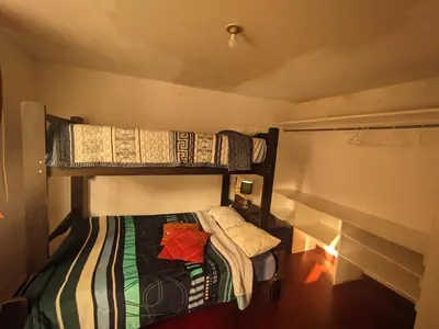 a room with two bunk beds in a room at Sumaq Wasi Caminos Del Inca in Lima