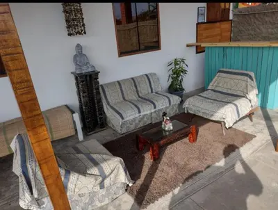a living room with two couches and a coffee table at Casita de Playa in Barranca