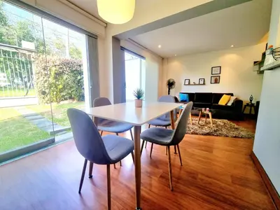 a dining room with a table and chairs at DuplexTOP Miraflores Queen SmartTV Lima 1B 101 in Lima