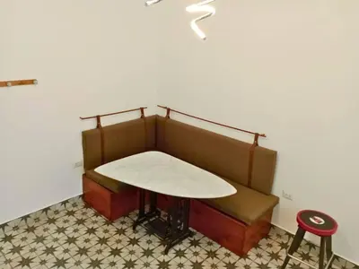 a bench with a table and a stool at Departamento boutique in Lima