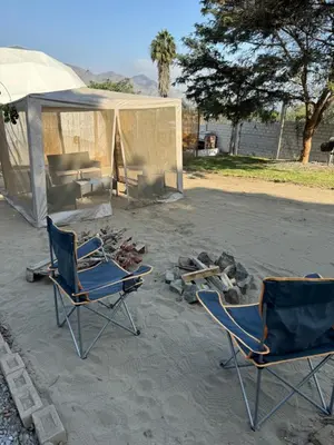 two chairs and a tent in a yard at Amaya Experience in Miraflores