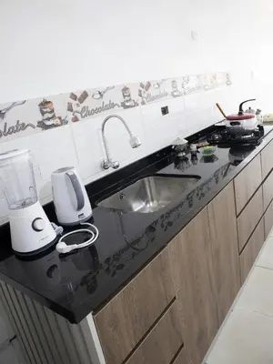 a kitchen with a sink and a counter top at Resort Maldo in Ayacucho
