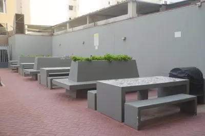 a row of benches with potted plants on them at Super céntrico y Hermoso Muy cerca a INEN in Lima