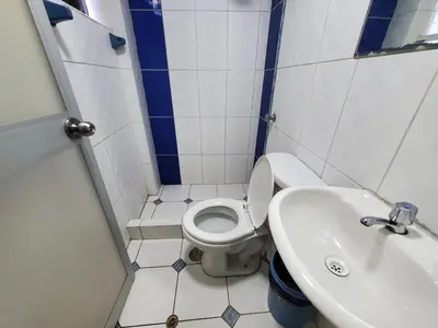 a small bathroom with a toilet and a sink at Jebas House in Cusco