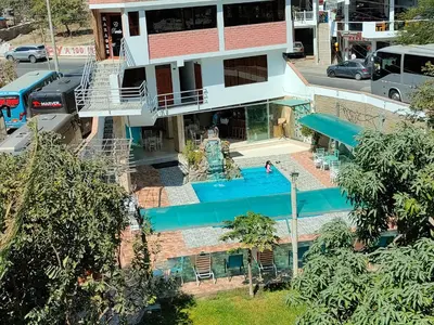 an aerial view of a building with a swimming pool at El Paraíso de Lunahuaná in Lunahuaná