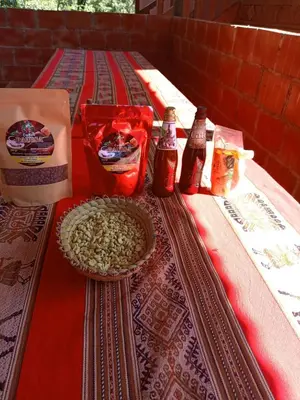 a table with food and drinks on top of it at Lucmabamba Dulcesueños Xiomara in Sahuayacu
