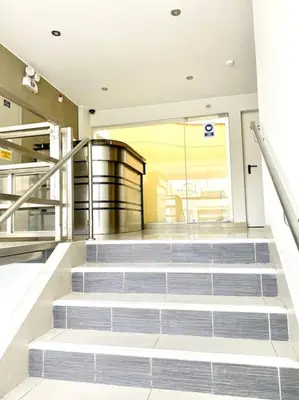 a set of stairs in a building with a lobby at Sai in Lima