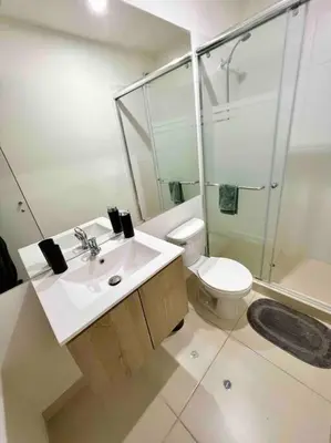 a bathroom with a sink and a toilet and a shower at Departamento estrenó céntrico a universidades in Lima
