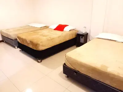 two beds sitting in a room with at Centro Histórico de Lima, Departamentos Temporales in Lima