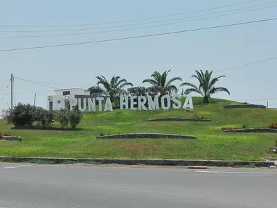 a sign that says punta hermososa on a hill at Punta Hermosa in Punta Hermosa