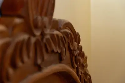 a close up of the back of a wooden chair at Conquistador Hotel in Cusco