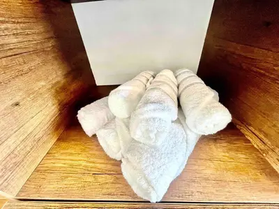 a bunch of rolled up towels sitting on a table at La Finca Ica in Ica