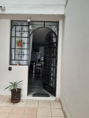 an entrance to a house with a black door at Just for me in Lima