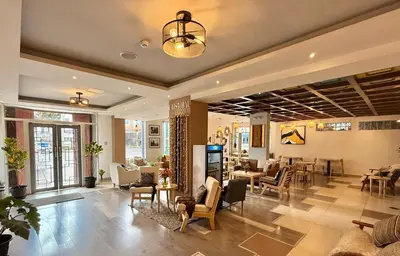 a lobby of a store with chairs and tables at CASA CRISTOBAL Centenario in Cusco