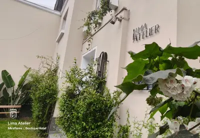 a building with plants on the side of it at Lima Atelier Boutique in Lima