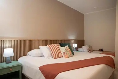 a bedroom with a large bed with pillows at Lima Atelier Boutique in Lima
