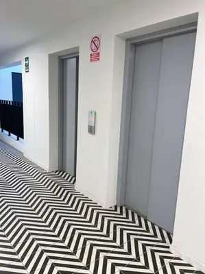 a hallway with black and white stripes on the floor at Cómodo y silencioso Apartamento 1BR en Barranco in Lima