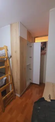 a room with a bunk bed and a closet at Departamento completo cerca al Centro Histórico de Lima y al aeropuerto in Lima