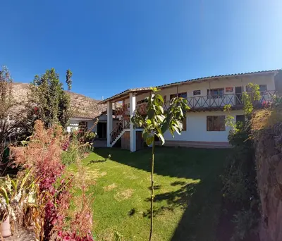a view of a house with a yard at Hostal Miramonti in Urubamba