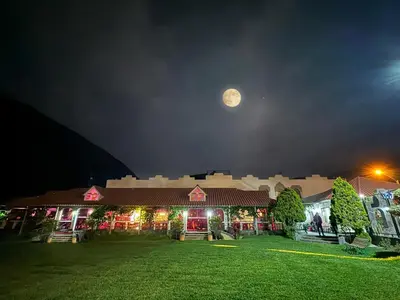 a large building with a moon in the sky at Villasol Hotel in Lunahuaná