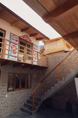a building with stairs and a balcony on it at Casa Alba Ollantaytambo in Ollantaytambo