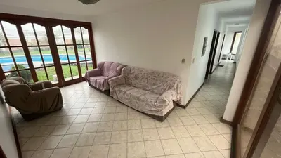a living room with a couch and a chair at Casa Grande de Campo en Huachipa in Lima