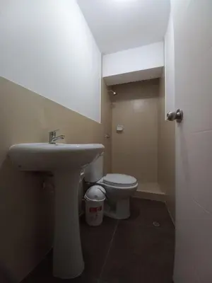 a bathroom with a sink and a toilet at Casa Linda San Miguel in Lima