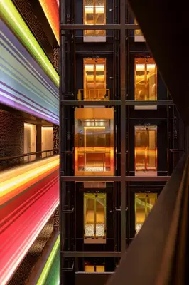 a building with multicolored windows in a city at Nhow Lima in Lima