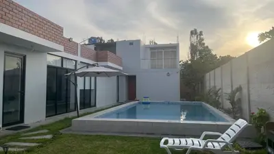 a swimming pool in the backyard of a house at Casa de Campo Aucallama in Huaral