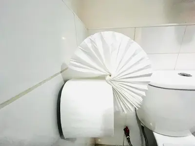 a white toilet with a fan on top of it at Rojas Plaza Boutique in Cusco