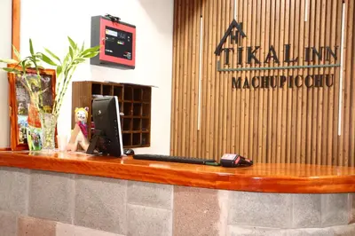 a desk with a laptop computer on top of it at Tikal Inn Machupicchu in Machu Picchu