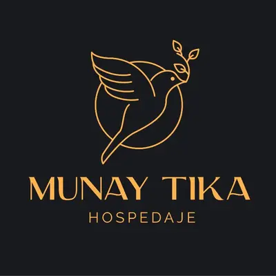 a gold logo with a bird carrying a plant at Munay Tika house in Cusco