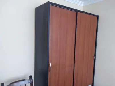 a wooden door in the corner of a room at Departamento Centro Financiero San isidro in Lima