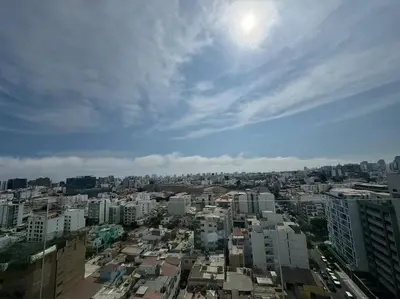 a view of a city with buildings and the sky at Departamento de Estreno Lima Miraflores in Lima