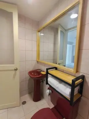 a bathroom with a sink and a mirror at Central Market Hotel San pedro in Cusco