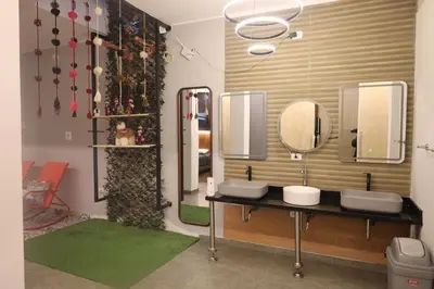 a bathroom with two sinks and two mirrors at Casa sabina hostel in Lima