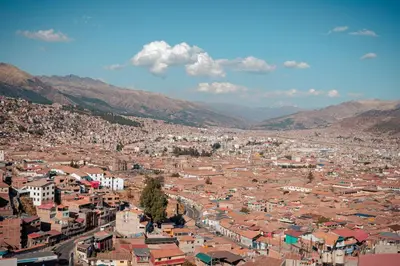 an aerial view of a city with buildings and mountains at Panoramic Cusco cabaña in Cusco