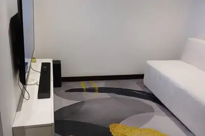 a bedroom with a bed and a carpet on the floor at Luxury Apartments Moon Suites Top in Lima