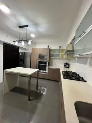 a kitchen with a white table and a stove at Luxury Apartments Moon Suites Top in Lima