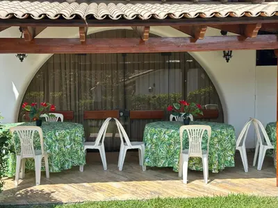 a group of tables and chairs on a patio at Casa de Campo Condominio El Pueblo-Santa Clara,Ate in Lima