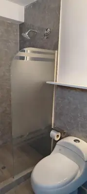 a bathroom with a toilet and a shower at Panoramic Cusco in Cusco
