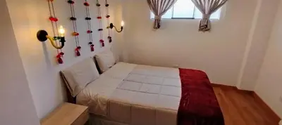 a small bedroom with a bed in a room at Panoramic Cusco in Cusco