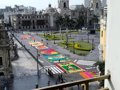 a city street with many paintings on the street at Departamento frente a palacio gobierno in Lima