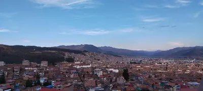 a view of a city with mountains in the background at Panoramic Cusco in Cusco