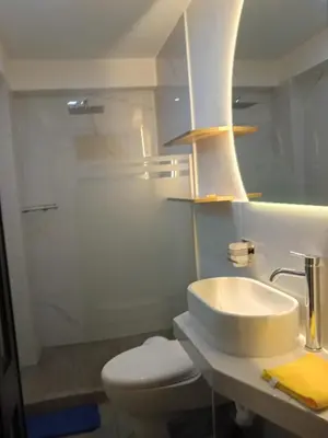 a bathroom with a sink and a toilet and a shower at Panoramic Cusco in Cusco