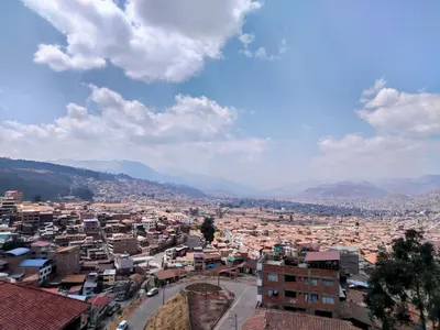 a city view of a city with buildings at Panoramic Cusco in Cusco