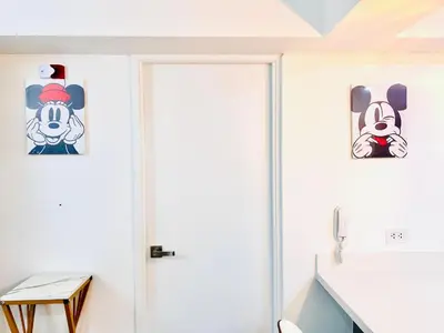 a door in a room with paintings on the wall at Pacific apartamento Miraflores in Lima